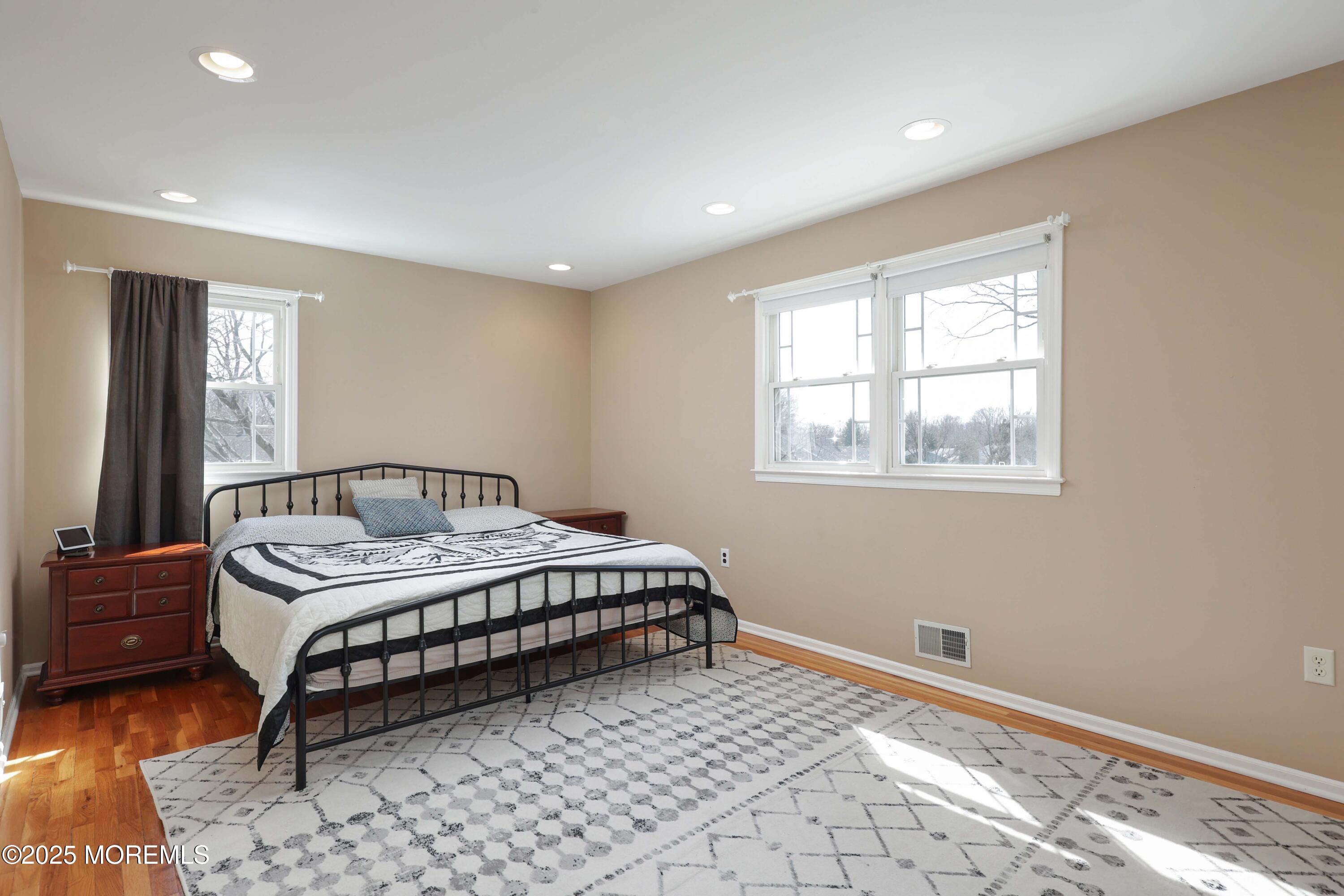 6 Hawthorne Road Red Bank, NJ 07701 - Photo 19 of 40 a spacious bedroom with a bed and window