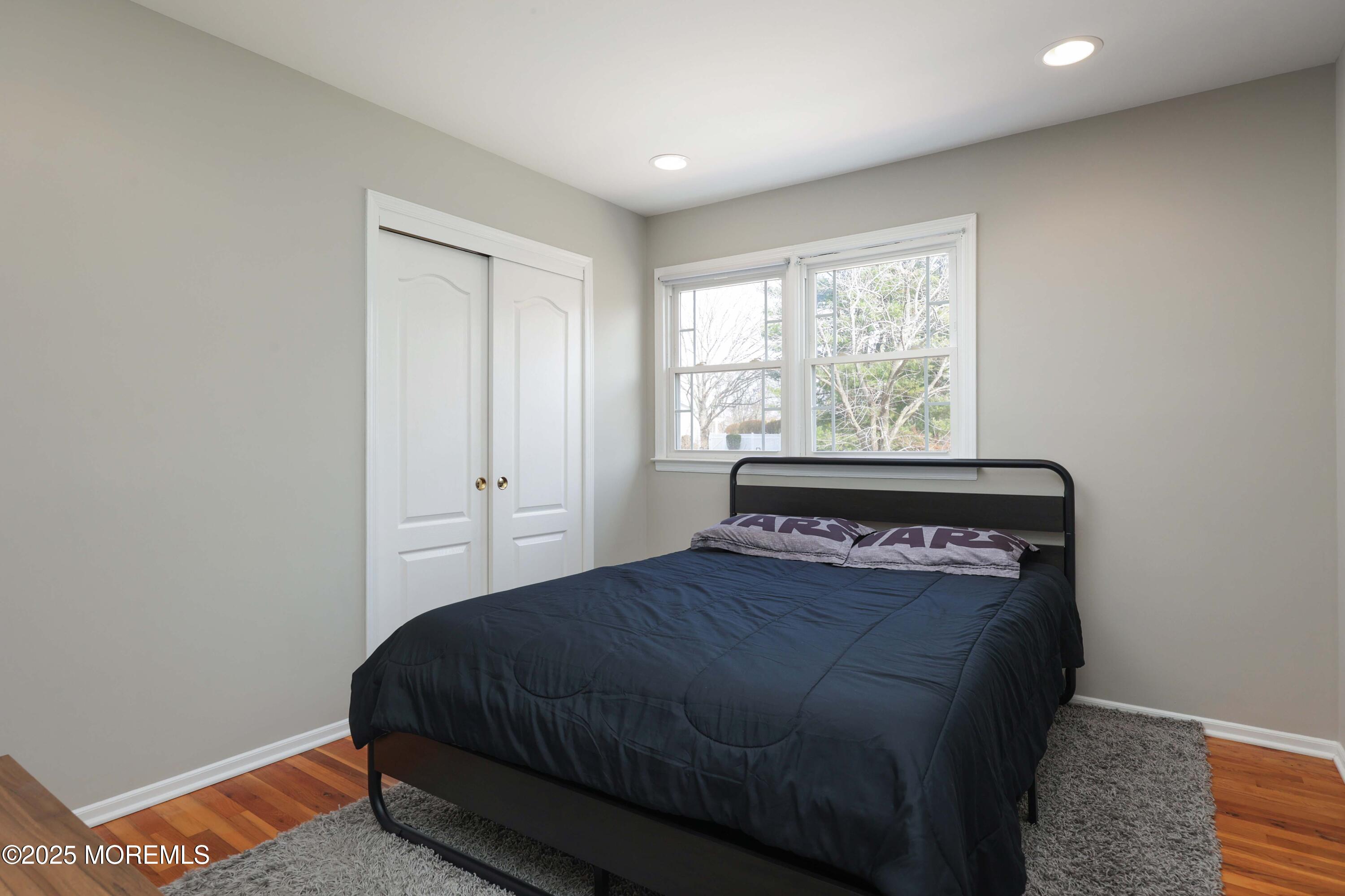 6 Hawthorne Road Red Bank, NJ 07701 - Photo 22 of 40 a bedroom with a bed and window