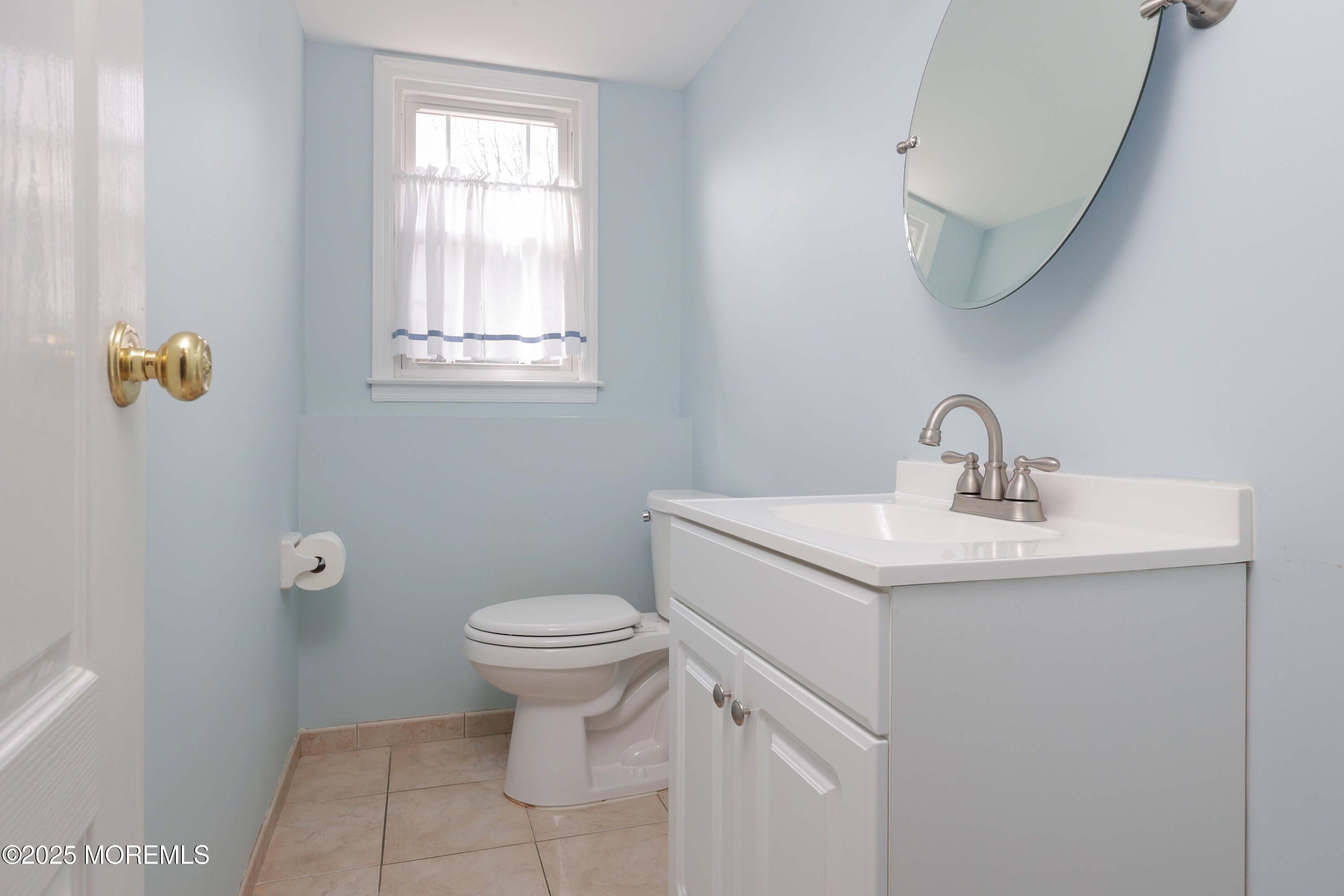 6 Hawthorne Road Red Bank, NJ 07701 - Photo 27 of 40 a bathroom with a sink toilet and a window