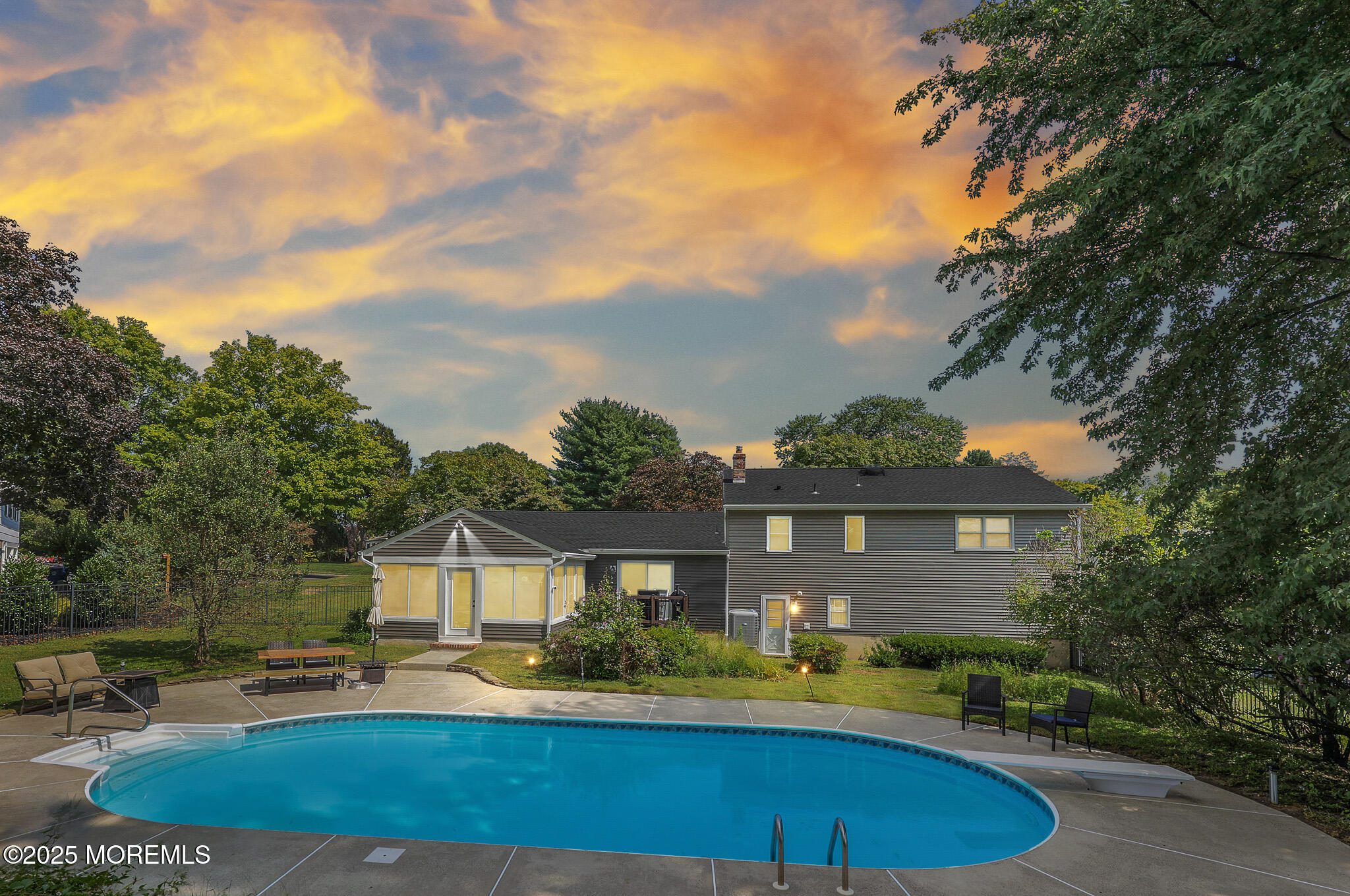 6 Hawthorne Road Red Bank, NJ 07701 - Photo 30 of 40 a front view of a house with a yard table and chairs