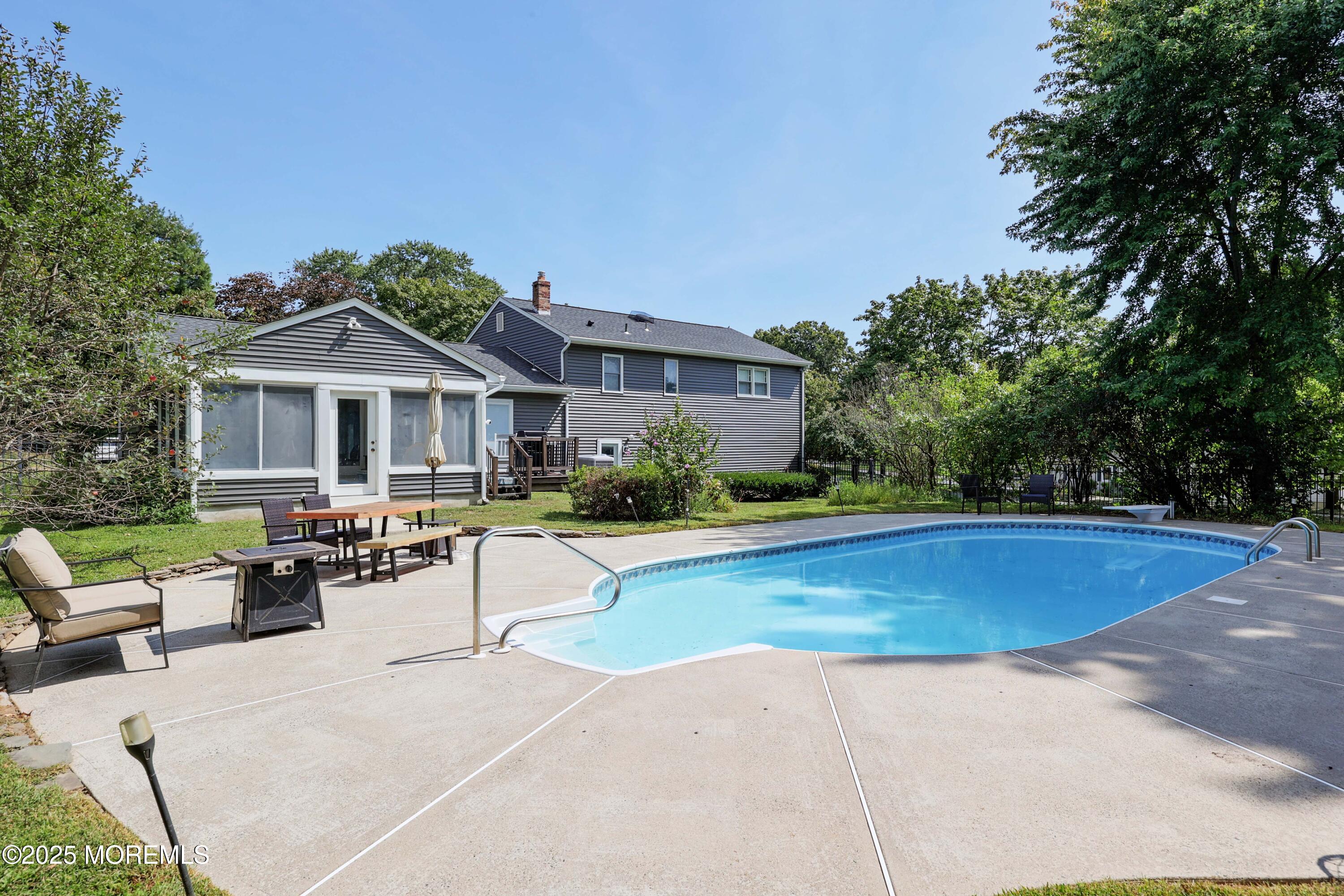 6 Hawthorne Road Red Bank, NJ 07701 - Photo 31 of 40 a view of house with swimming pool and chairs