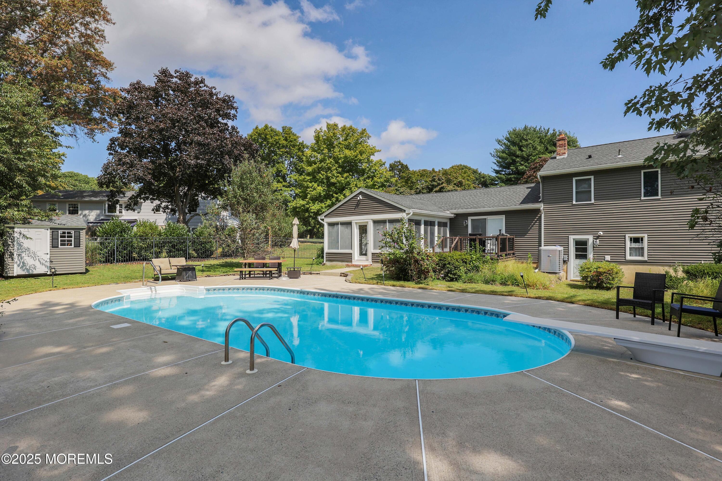 6 Hawthorne Road Red Bank, NJ 07701 - Photo 34 of 40 a view of a house with swimming pool and sitting area