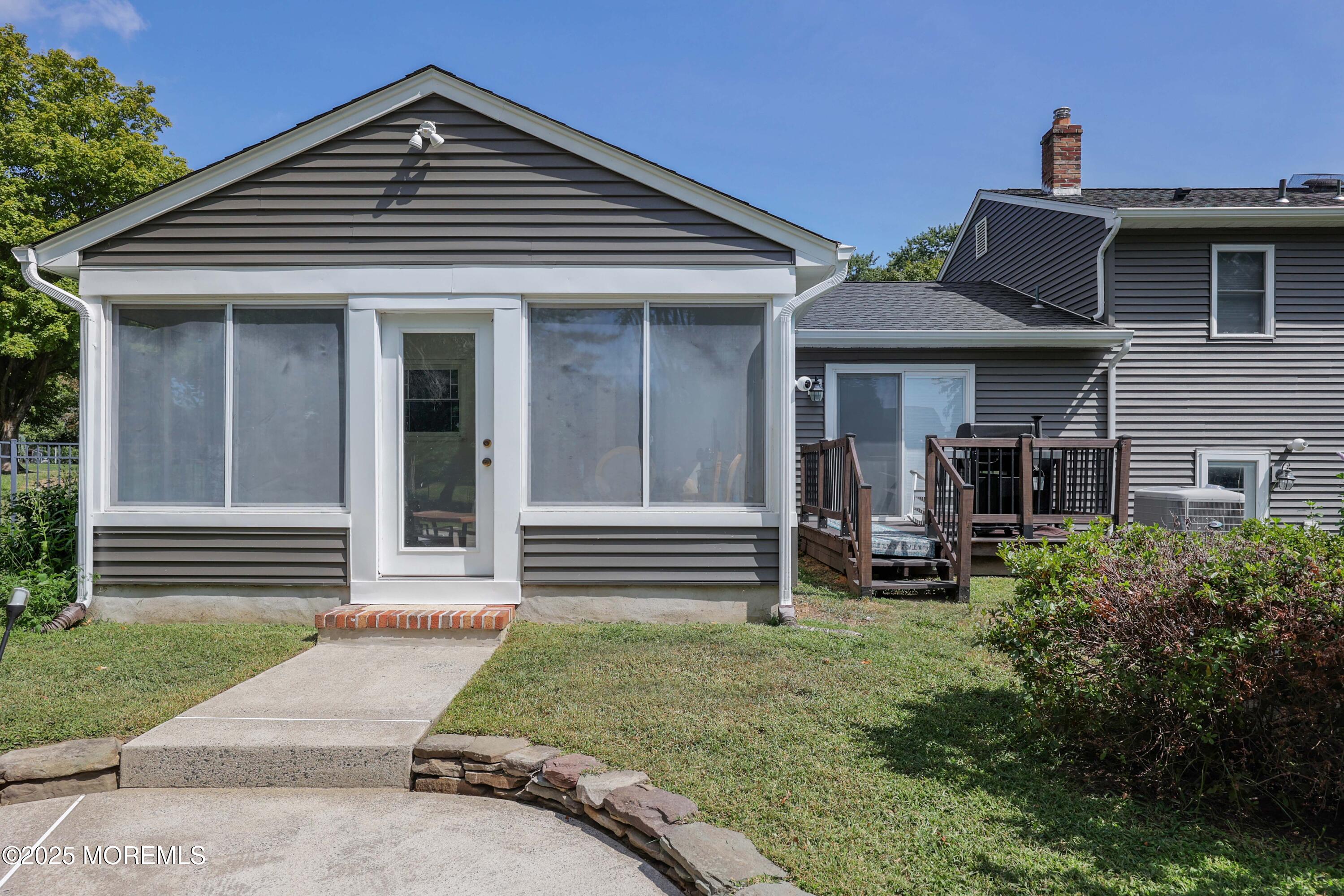 6 Hawthorne Road Red Bank, NJ 07701 - Photo 36 of 40 a front view of a house with a yard