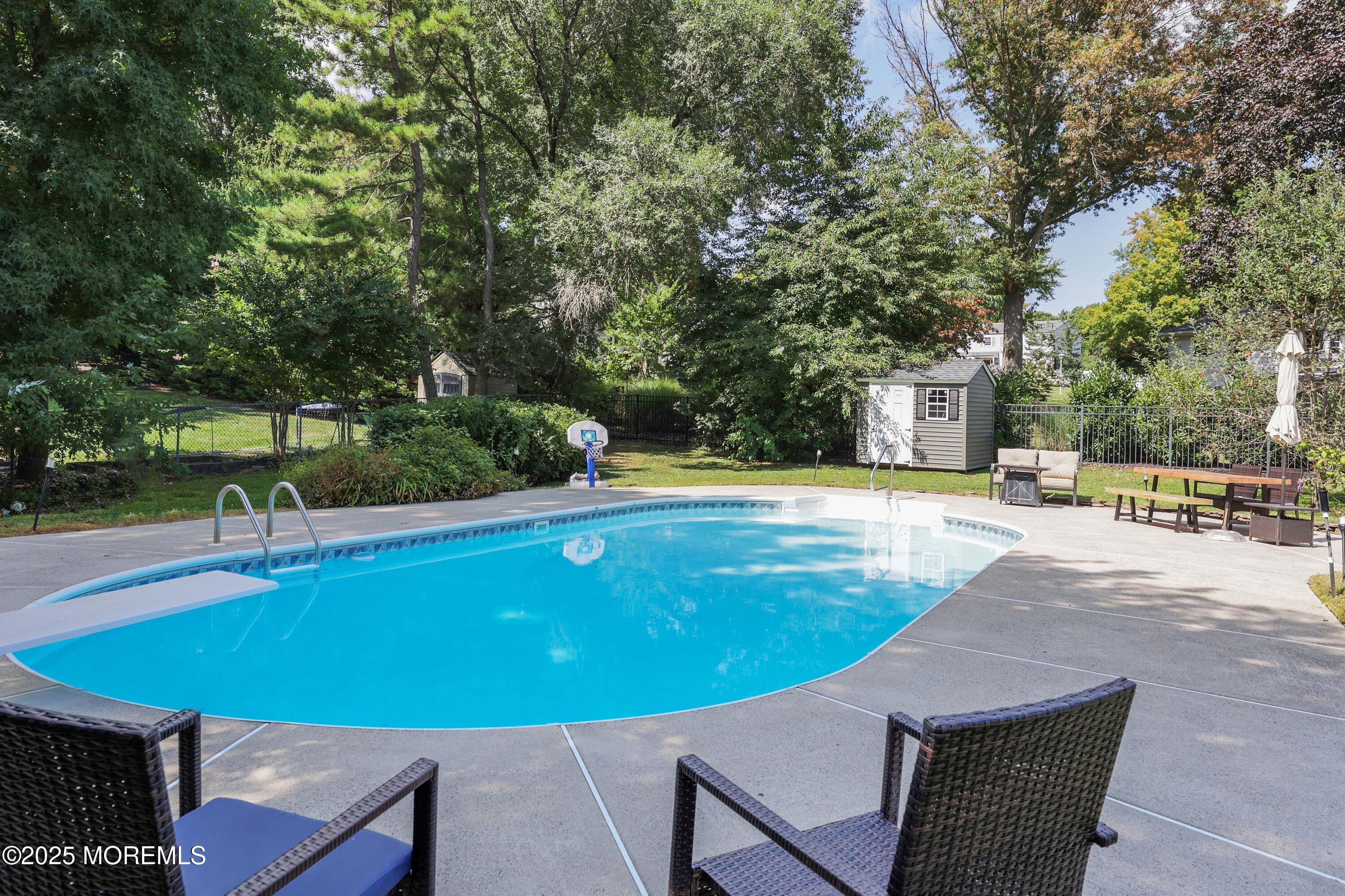 6 Hawthorne Road Red Bank, NJ 07701 - Photo 37 of 40 a view of a swimming pool with a patio