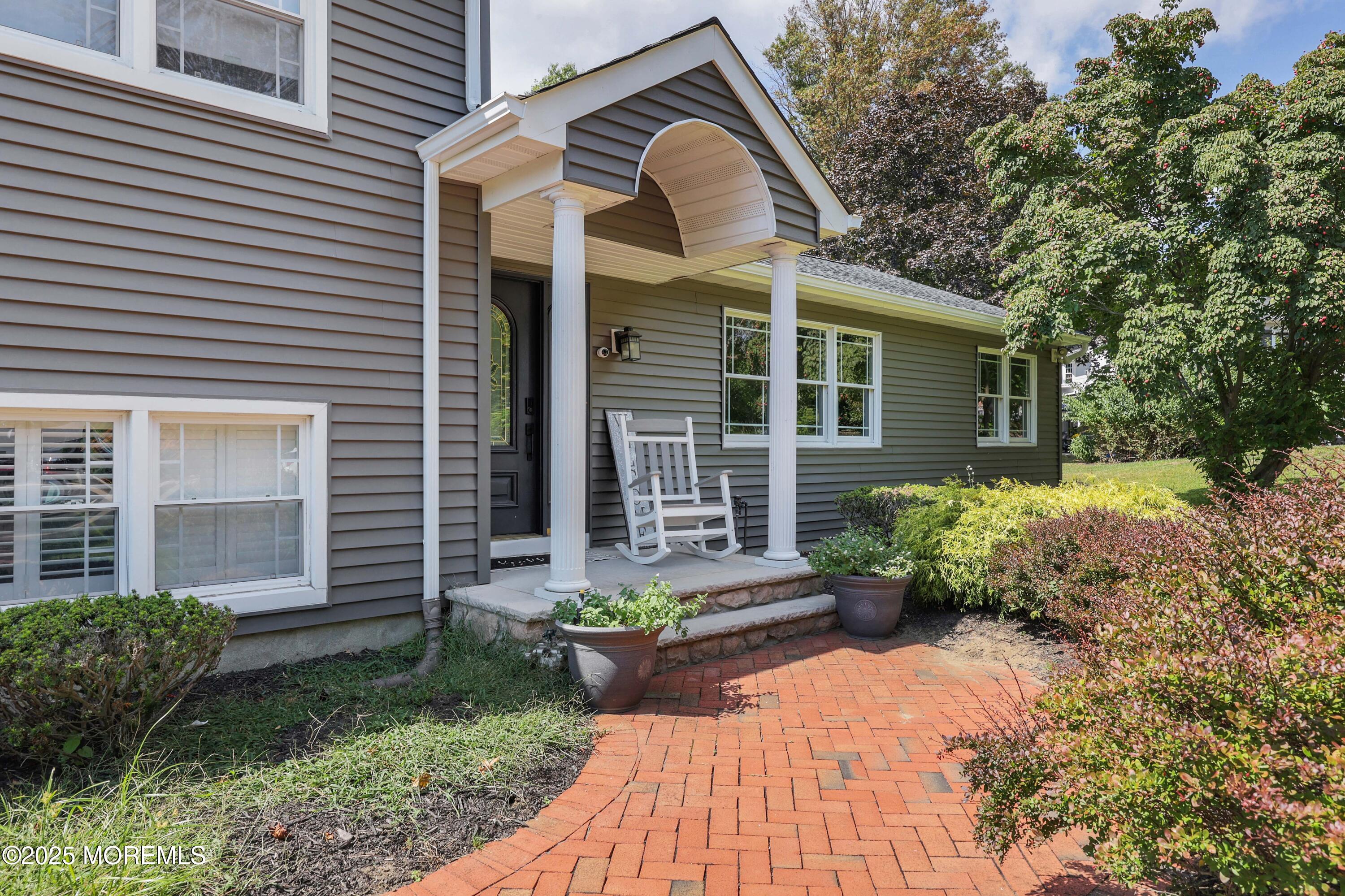 6 Hawthorne Road Red Bank, NJ 07701 - Photo 4 of 40 a front view of a house with garden