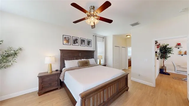 a bedroom with a bed and a chandelier