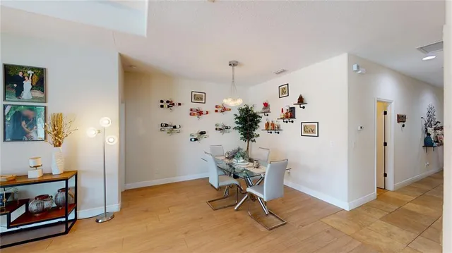 a view of a livingroom with furniture and a kitchen
