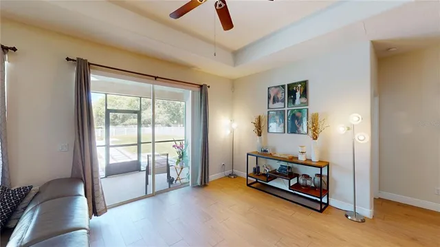 a view of a livingroom with furniture and a window