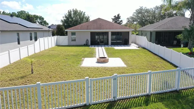 a view of a house with a yard