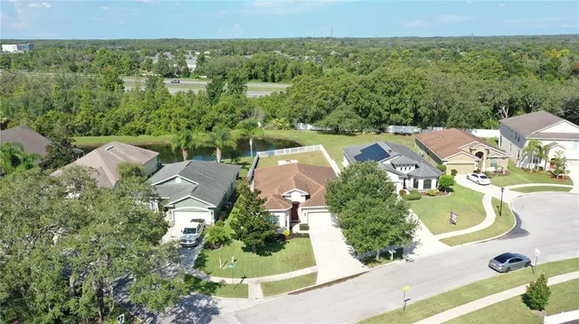 a view of a hallway view with wooden floor and entryway