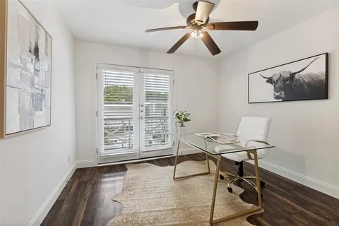 a workspace with furniture and a window