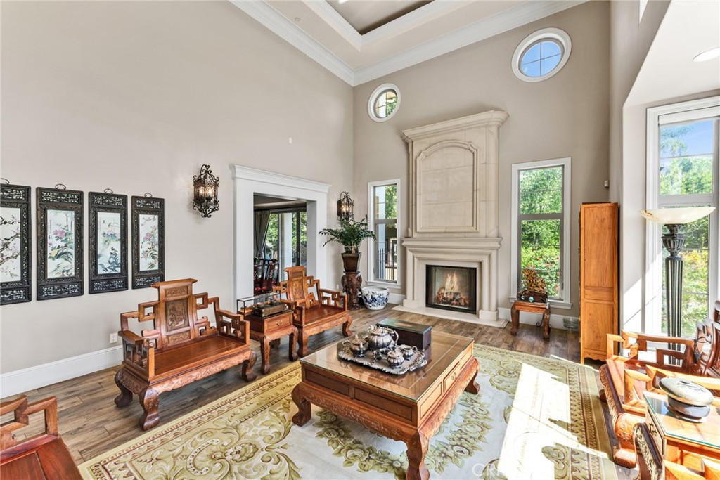 4117 Mt Baldy Road Claremont, CA 91711 - Photo 19 of 75 a living room with furniture and a fireplace