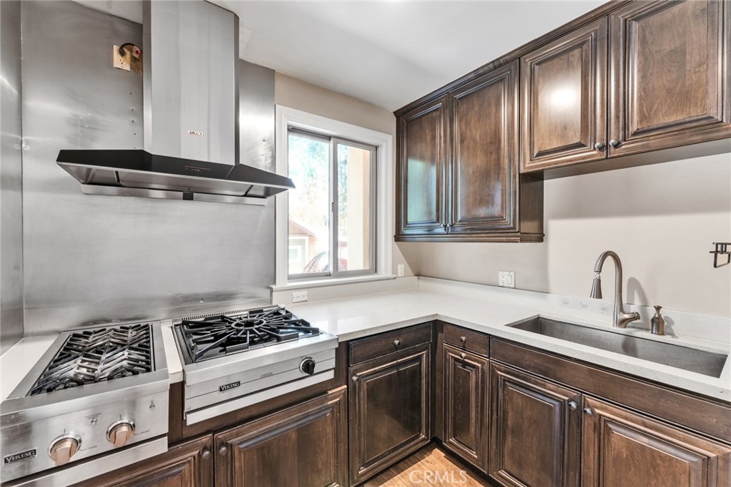 4117 Mt Baldy Road Claremont, CA 91711 - Photo 29 of 75 a kitchen with granite countertop a stove and cabinets