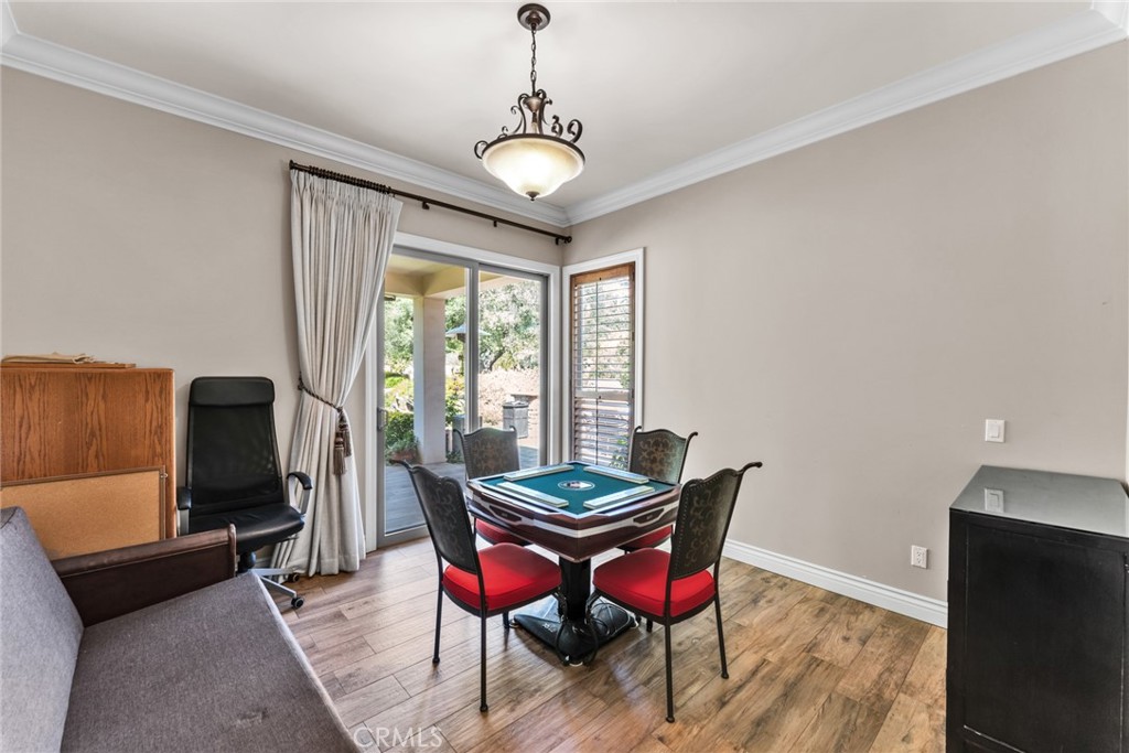 4117 Mt Baldy Road Claremont, CA 91711 - Photo 31 of 75 a view of a dining room with furniture window and wooden floor