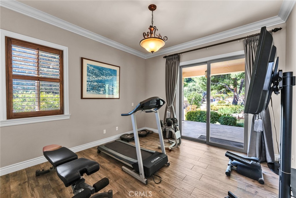 4117 Mt Baldy Road Claremont, CA 91711 - Photo 32 of 75 a living room with furniture and a floor to ceiling window