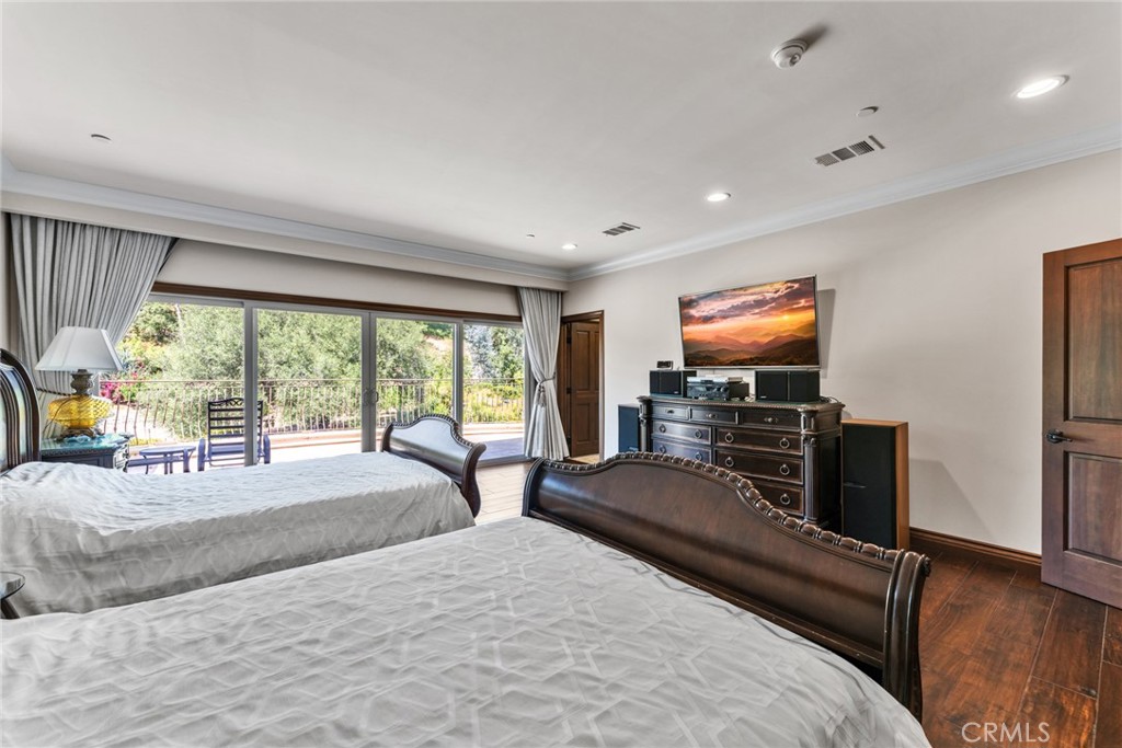 4117 Mt Baldy Road Claremont, CA 91711 - Photo 35 of 75 a bedroom with furniture and a flat screen tv