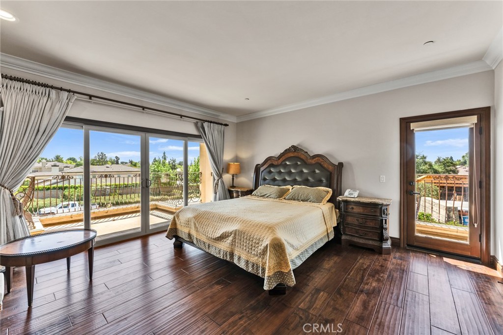4117 Mt Baldy Road Claremont, CA 91711 - Photo 40 of 75 a bedroom with a large bed and a large window