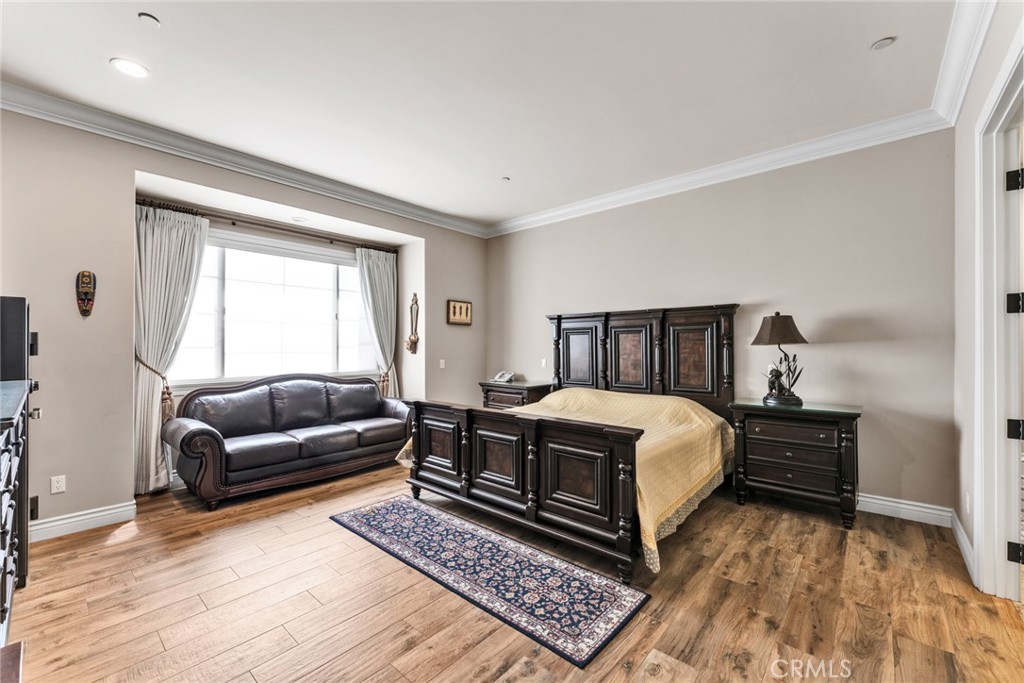 4117 Mt Baldy Road Claremont, CA 91711 - Photo 43 of 75 a bedroom with a bed wooden floor and window