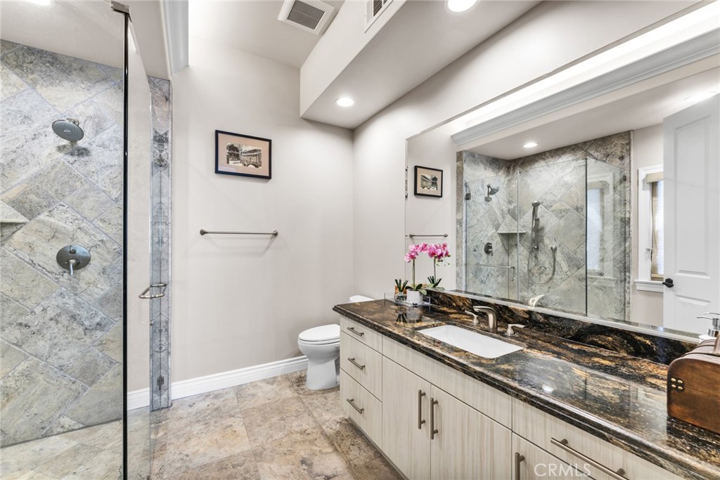 4117 Mt Baldy Road Claremont, CA 91711 - Photo 44 of 75 a bathroom with a granite countertop sink and a mirror