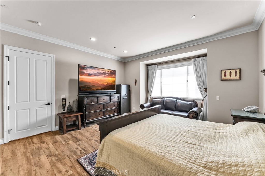 4117 Mt Baldy Road Claremont, CA 91711 - Photo 46 of 75 a bedroom with a bed and a flat screen tv