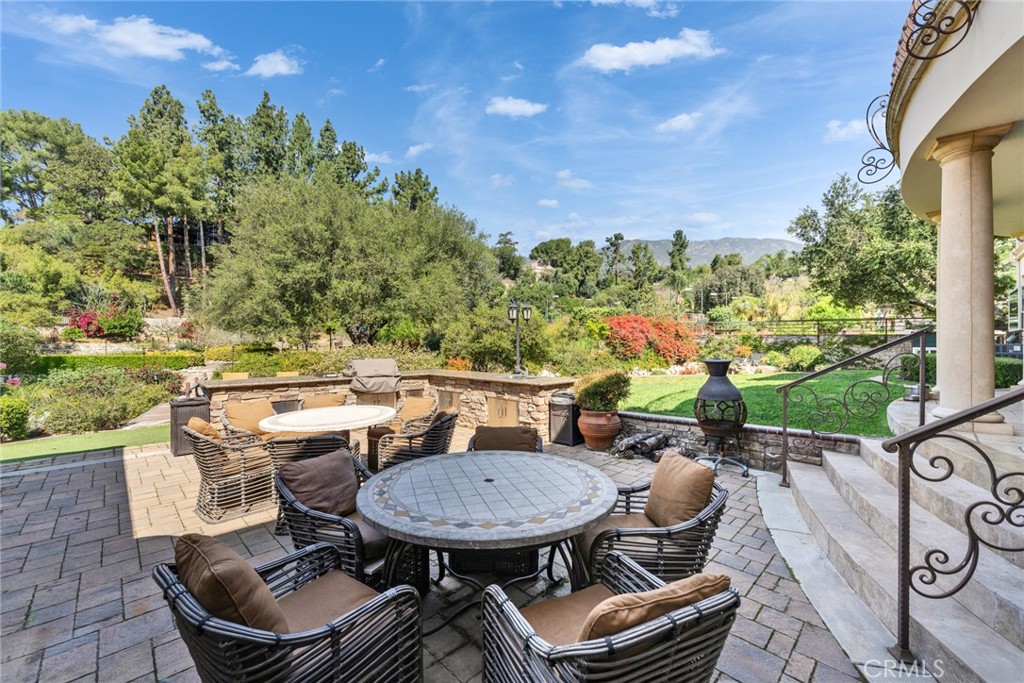 4117 Mt Baldy Road Claremont, CA 91711 - Photo 52 of 75 a view of a patio with table and chairs and potted plants