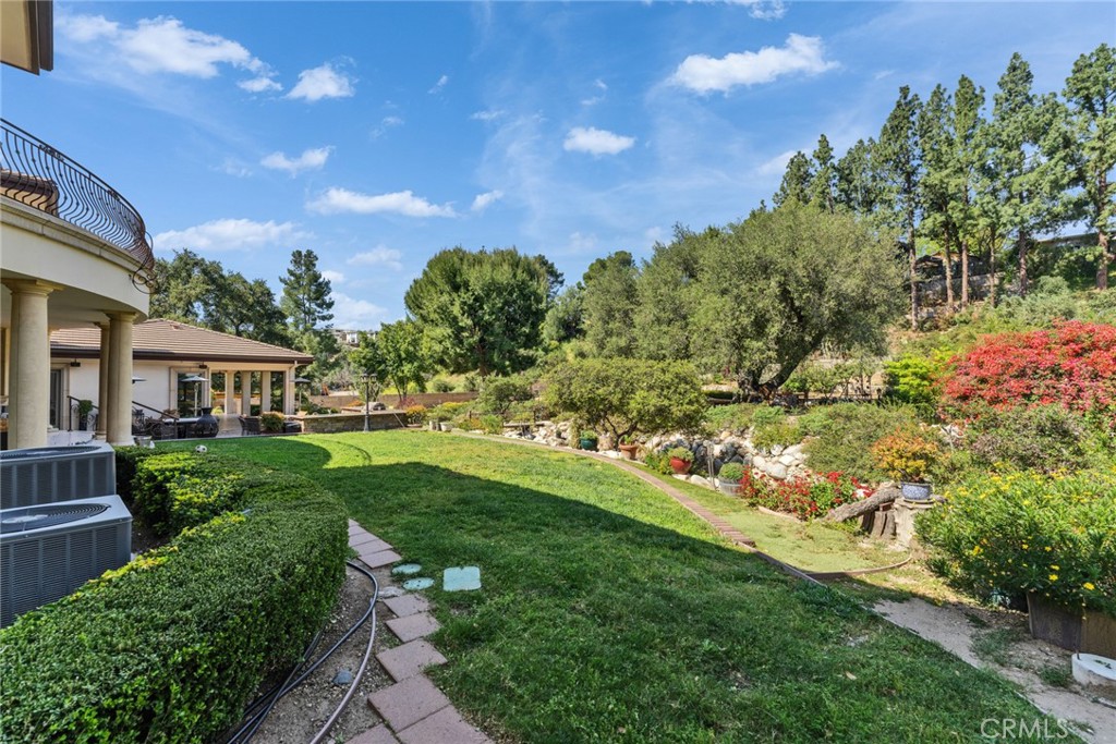 4117 Mt Baldy Road Claremont, CA 91711 - Photo 54 of 75 a view of a garden with a building in the background