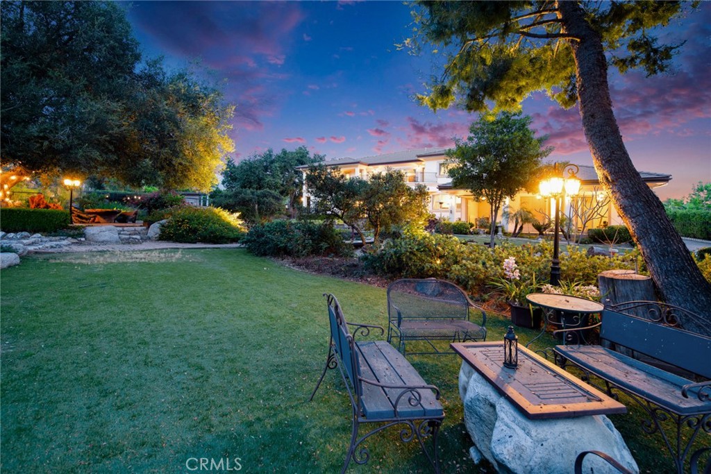 4117 Mt Baldy Road Claremont, CA 91711 - Photo 71 of 75 a view of a patio with couches table and chairs and potted plants