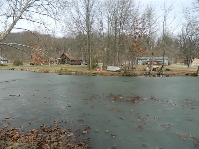 a view of yard with wooden fence