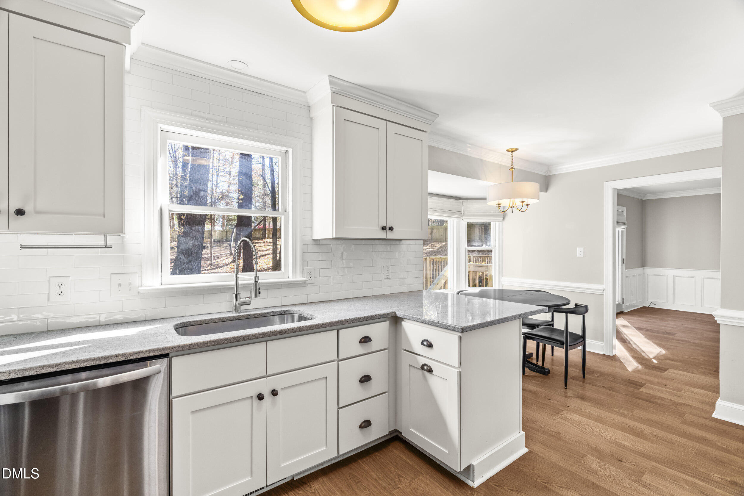 10716 Marthas Way Raleigh, NC 27615 - Photo 11 of 32 a kitchen with white cabinets and sink