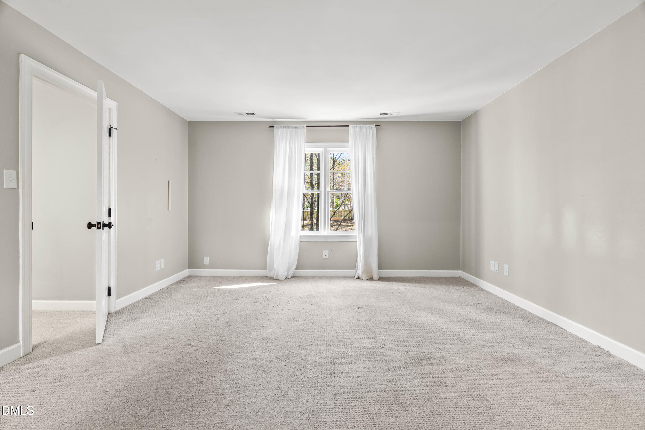 10716 Marthas Way Raleigh, NC 27615 - Photo 15 of 32 a view of an empty room with a window