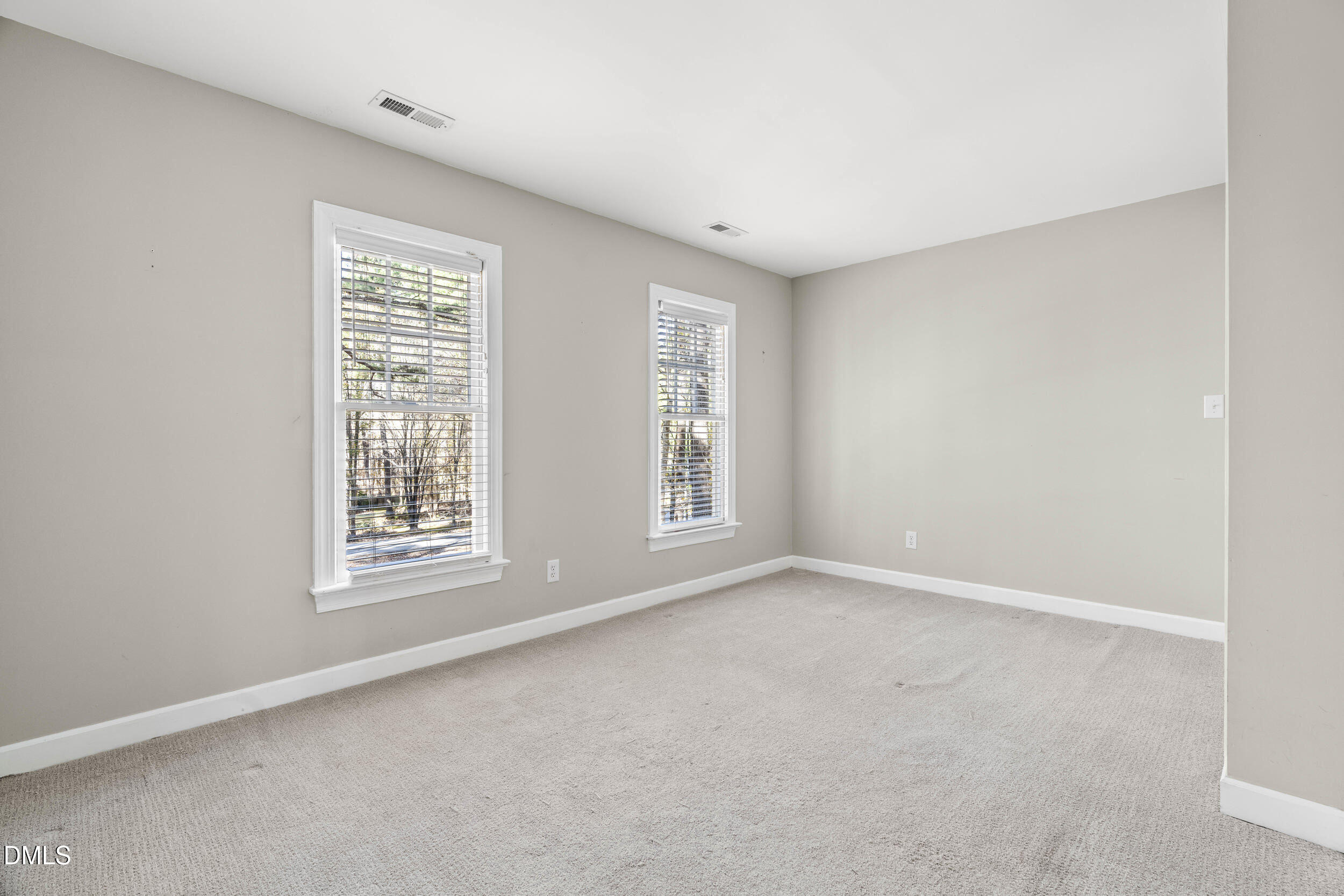 10716 Marthas Way Raleigh, NC 27615 - Photo 23 of 32 an empty room with windows