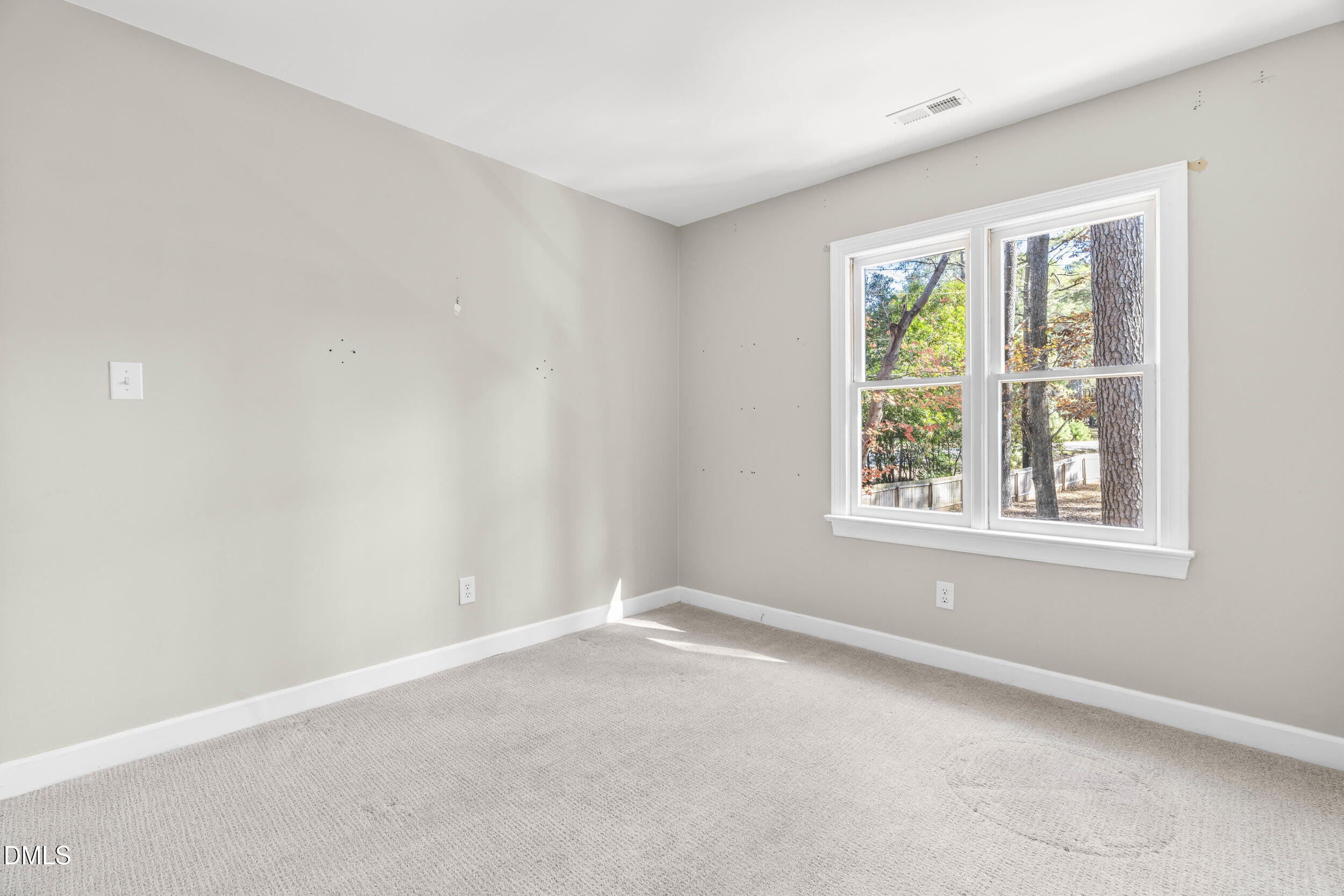 10716 Marthas Way Raleigh, NC 27615 - Photo 24 of 32 an empty room with windows
