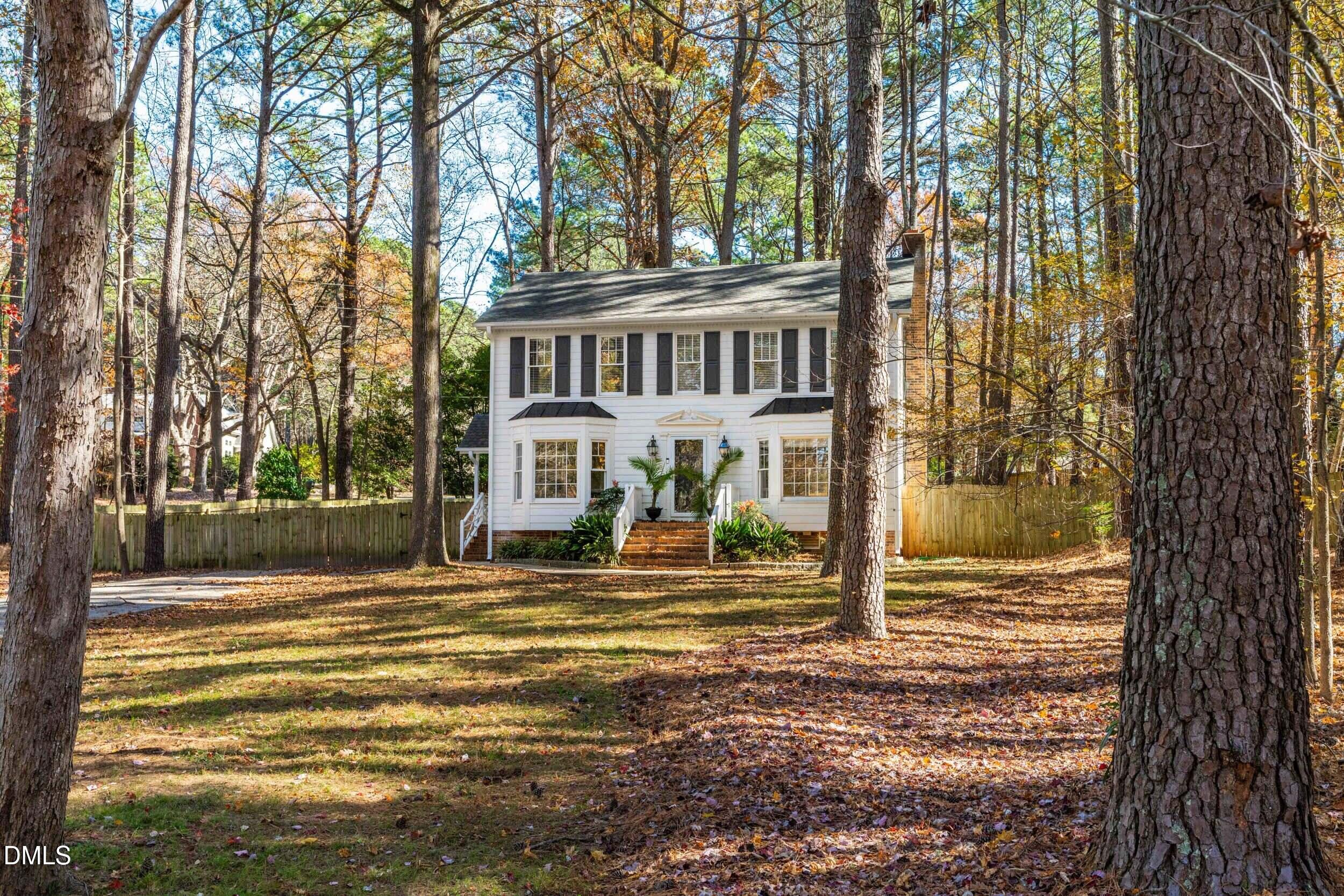 10716 Marthas Way Raleigh, NC 27615 - Photo 2 of 32 a view of a house with backyard and trees