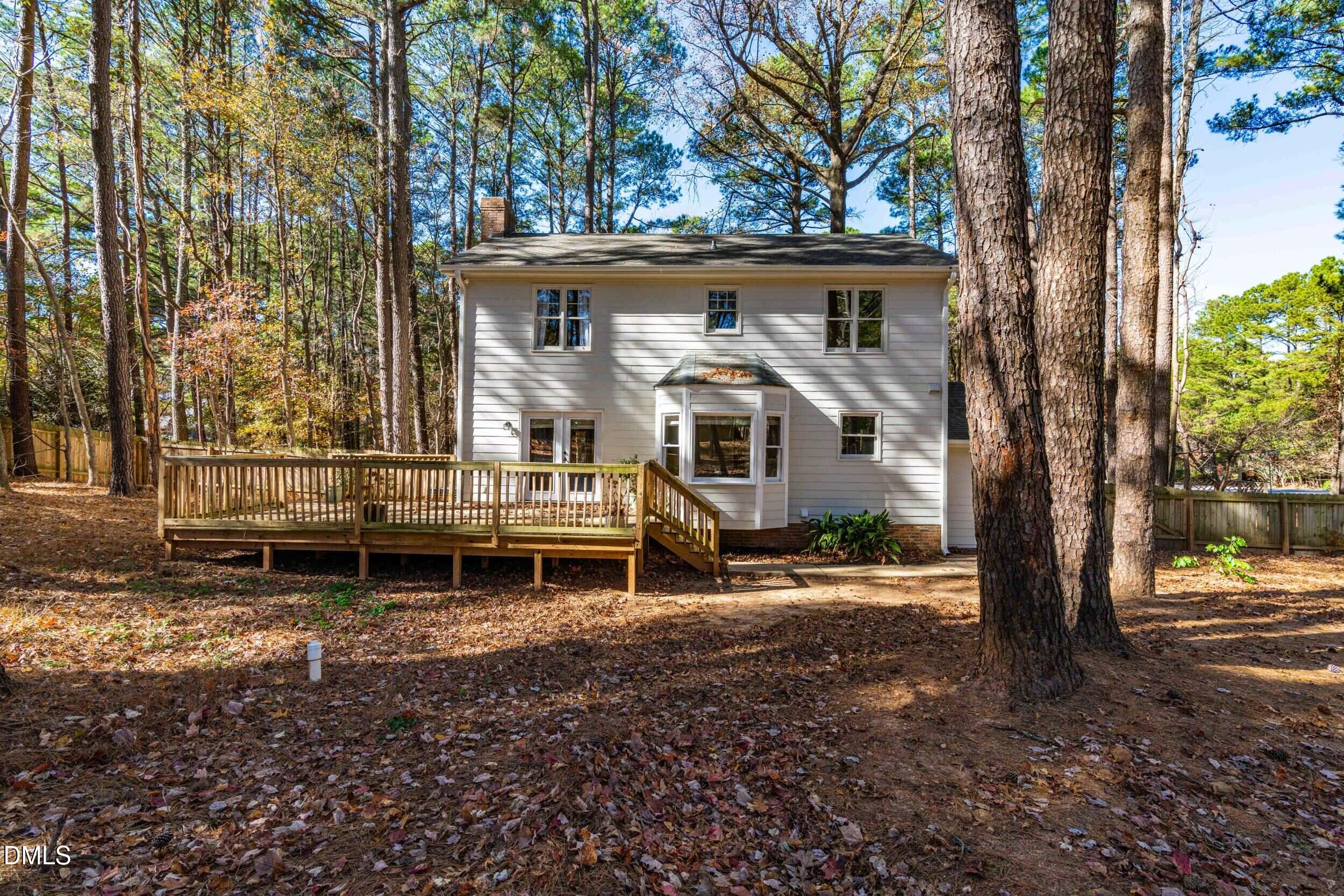 10716 Marthas Way Raleigh, NC 27615 - Photo 30 of 32 a front view of a house with a garden