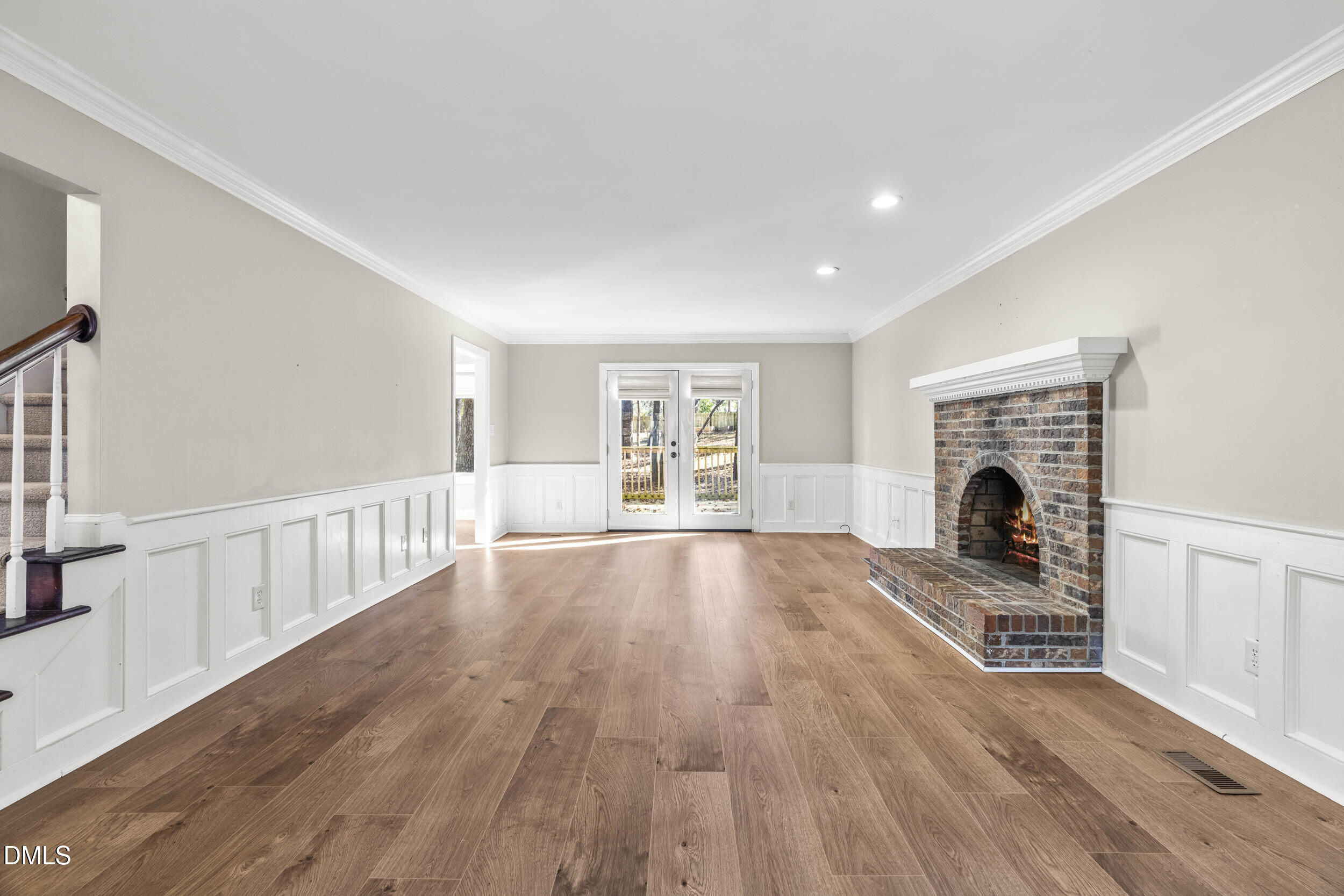 10716 Marthas Way Raleigh, NC 27615 - Photo 7 of 32 a view of livingroom with furniture a fireplace and wooden floor