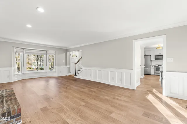 a view of livingroom with furniture a fireplace and wooden floor