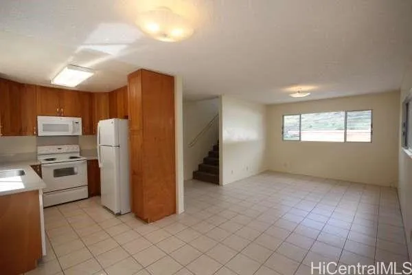 a kitchen with refrigerator and window
