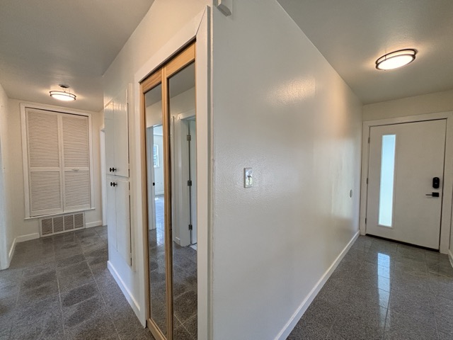 6303 Brookside Drive Austin, TX 78723 - Photo 14 of 26 a view of a hallway with wooden floor