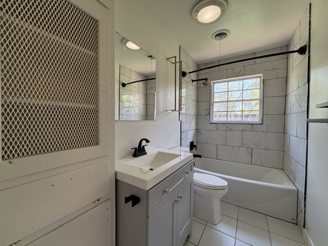 6303 Brookside Drive Austin, TX 78723 - Photo 18 of 26 a bathroom with a sink toilet tub and shower