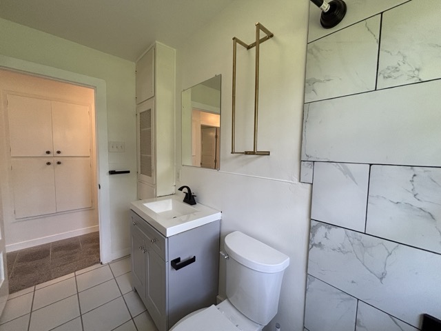 6303 Brookside Drive Austin, TX 78723 - Photo 19 of 26 a bathroom with a toilet sink and mirror