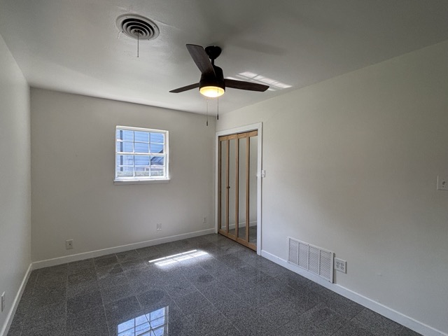 6303 Brookside Drive Austin, TX 78723 - Photo 21 of 26 a view of an empty room and chandelier fan