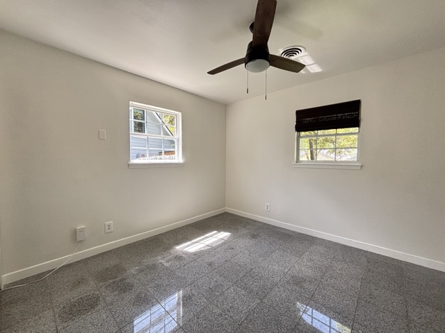 6303 Brookside Drive Austin, TX 78723 - Photo 24 of 26 a view of room with ceiling fan and window