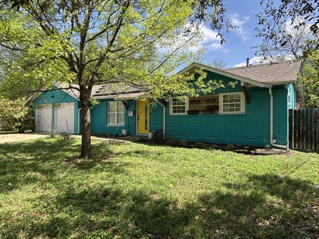 6303 Brookside Drive Austin, TX 78723 - Photo 3 of 26 a backyard of a house with lots of green space