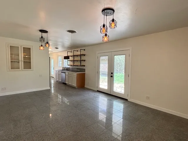 a view of a kitchen with a stove cabinets and a ceiling fan