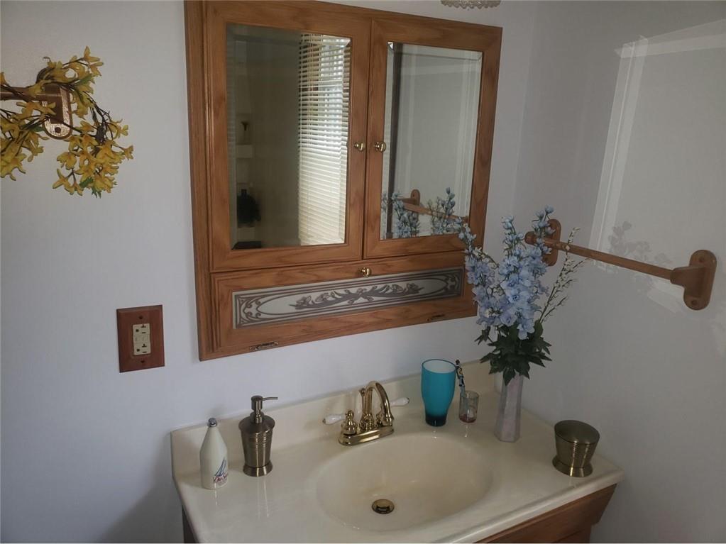 1054 Winfield Road Cabot, PA 16023 - Photo 13 of 22 a bathroom with a sink and a mirror