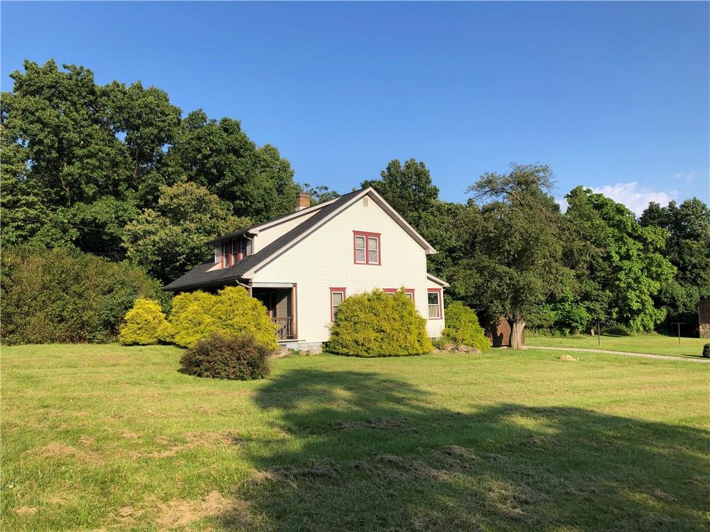1054 Winfield Road Cabot, PA 16023 - Photo 19 of 22 a view of a house with a yard
