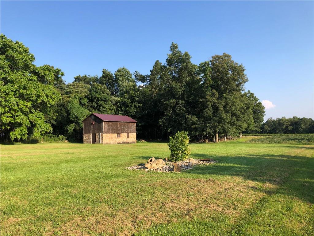 1054 Winfield Road Cabot, PA 16023 - Photo 21 of 22 a big yard with lots of green space and fog