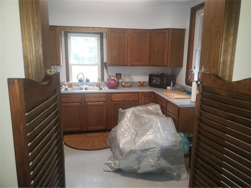 1054 Winfield Road Cabot, PA 16023 - Photo 9 of 22 a kitchen with a sink and cabinets