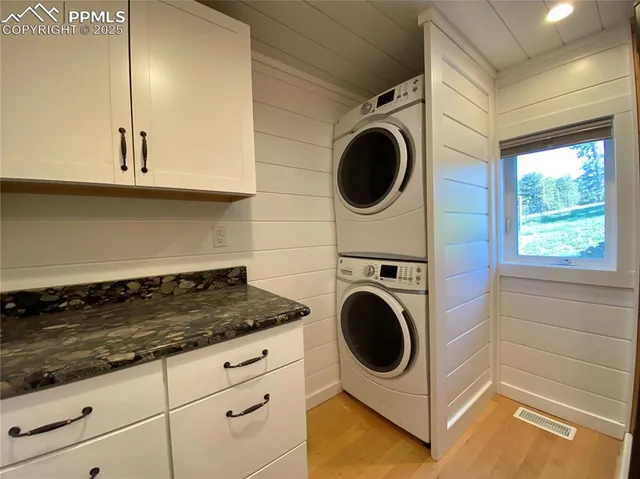a utility room with sink dryer and washer