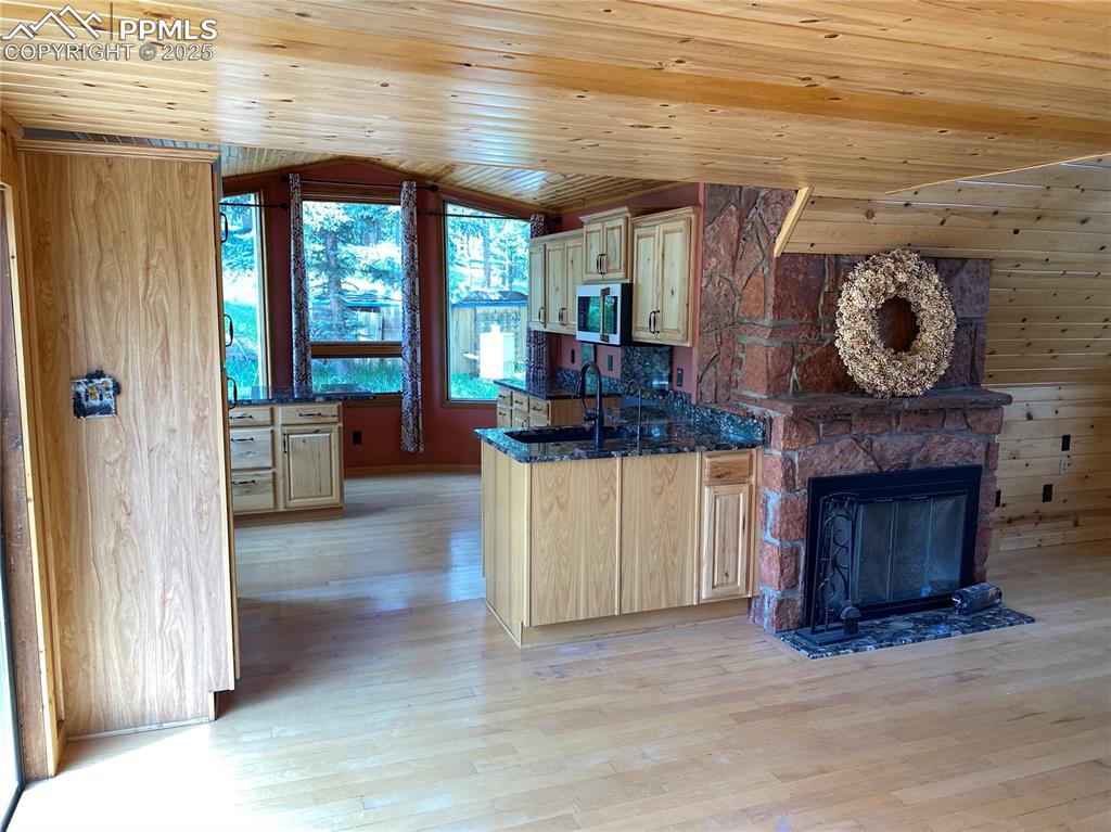 845 Markus Road Woodland Park, CO 80863 - Photo 19 of 40 a view of a hallway with fireplace and windows